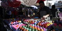epa09169258 Vendors offer colorful handmade decorated Easter egg at a farmers market in Belgrade, Serbia, 30 April 2021. Orthodox Serbs celebrate Easter on 02 May 2021, according to the Julian calendar.  EPA-EFE/ANDREJ CUKIC