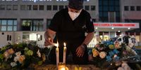 A doctor lights a candle on Thursday, 21 January on the helipad of Milpark Hospital. <br>Photo / Shiraaz Mohamed