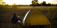 Joseph ‘Travel Mufasa’ Makowa sets up camp for the night under the Zimbabwean sky. (Screengrab: Wild Africa Fund)