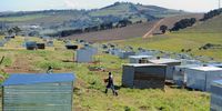 People erect shacks at Louiesenhof wine farm near Kayamandi on 10 August 2018 in Stellenbosch. This came two days after the shacks had been demolished by officials and Red Ants after a court interdict to remove unoccupied structures and to prevent more people from moving on to a vacant portion of the property. (Photo: Gallo Images / Brenton Geach)
