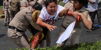  Indian security personnel detain a Tibetan Youth Congress (TYC) activist outside the Chinese Embassy in New Delhi, India, 11 April 2025. TYC members were protesting the alleged sudden and mysterious death of Tulku Hungkar Dorje, a revered Tibetan religious leader, while in custody in Vietnam. The activists called for a transparent and independent investigation into the circumstances of his death and the public release of its findings.  EPA-EFE/RAJAT GUPTA