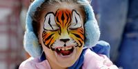  Daria, 8, a Romanian girl suffering from autism, accompanied by her mother Mihaela (not pictured), reacts after having her face painted by a volunteer entertainer during the 'Blue Festival', an event dedicated to the World Autism Awareness Day, in Obor Park, Bucharest, Romania, 02 April 2024. Dozens of children suffering from autism, accompanied by their relatives and friends and helped by volunteers, have participated in various games, painting and face painting workshops, skills and other activities organized by the NGOs Help Autism, Autism Romania, National Association for Children and Adults with Autism from Romania, Romanian Association of Therapies in Autism and ADHD under the slogan 'Not invisible!', to raise awareness among communities regarding autistic people in Romania. According to the World Health Organization (WHO), it is estimated that about 1 in 100 children is diagnosed with autism worldwide. World Autism Awareness Day, established by the United Nations General Assembly in 2007, is observed annually on 02 April.  EPA-EFE/ROBERT GHEMENT