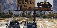 epaselect epa09069226 Part of an art installation composed of billboards and entitled 'Because You Know Ultimately We Will Band A Militia' by Xaviera Simmons, displayed as part of the Desert X exhibition near Palm Springs, California, USA, 11 March 2021. The Exhibition runs from 12 March to 16 May 2021.  EPA-EFE/ETIENNE LAURENT