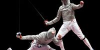 CHIBA, JAPAN - JULY 24: Junghwan Kim of Team Korea and Sandro Bazadze of Team Georgia both celebrate in the men’s sabre individual bronze medal boutof the fencing on day one of the Tokyo 2020 Olympic Games at Makuhari Messe Hall on July 24, 2021 in Chiba, Japan. (Photo by Elsa/Getty Images)