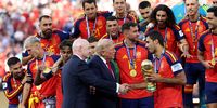 Rodri #16 of Spain is presented the FIFA World Cup Winner’s Trophy by Donald Trump and FIFA President Gianni Infantino after the team’s victory following during the FIFA World Cup 2026 Final match between Spain and Argentina at New York New Jersey Stadium on July 19, 2026 in East Rutherford, New Jersey. (Photo: Carl Recine/Getty Images)