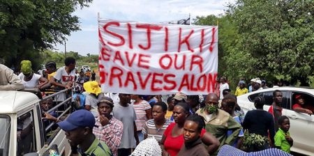 Uproar after alleged illegal sand miners dig up graves