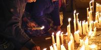 Annual pilgrimage to Sanctuary Our Lady of Namaacha, in mid-May (13 May in 2023). Pilgrims flock to the tiny, quaint,quiet town on the Eswatini border. Lighting candles in the church. Photographer: Mercedes Sayagues