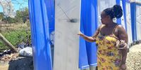 Akhona Zazini said many of the doors of the portable toilets are damaged, leaving residents with no privacy. Photo: Marecia Damons