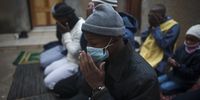 A group of men is seen during the Eid prayer in a court yard of a house in Soweto, Johannesburg, 25 May 2020. The group performed their Eid prayer at home despite living meters away from a mosque, which was closed due to the lockdown. As South Africa entered its 59th day of the national lockdown. Muslims were forced to celebrate their Eid under lockdown regulations which prohibited them from performing their early morning Eid prayers in masses. (Photo: Daily Maverick / Shiraaz Mohamed)