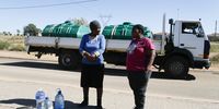 Constance Ngobeni and Grace Ngobeni residents of Kanana in Hamanskraal have to buy clean water due to a lack of service provision. (Photo: Felix Dlangamandla)