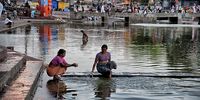 Women bathe in the Godavan River at the ancient city of Nashik. Image: Don Pinnock