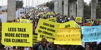 Climate activists hold placards and shout slogans at a march dubbed ‘The real Africa Climate Summit People's March’, held by civil society groups during a demonstration on the streets of Nairobi against the exclusion of civil society in climate talks. (Photo: EPA-EFE / Daniel Irungu)