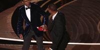 US actor Will Smith (right) swings at US actor Chris Rock during the 94th annual Academy Awards ceremony over an assumed verbal insult of Smith's wife, US actress Jada Pinkett Smith, at the Dolby Theatre in Hollywood, Los Angeles, California, US on 27 March 2022. (Photo: EPA-EFE/Etienne Laurent)