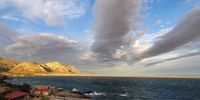 My wife and I drove around in Hermanus yesterday evening just before sunset.<br>I had rained during the day and, as you can see from the sea, the hot wind was blowing a gale.<br>I managed to get some striking cloud shots in the late sunshine and this is one of them.