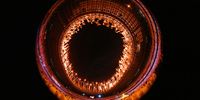 TOKYO, JAPAN - JULY 23: General view inside the stadium as fireworks go off while Naomi Osaka of Team Japan lights the Olympic cauldron with the Olympic torch during the Opening Ceremony of the Tokyo 2020 Olympic Games at Olympic Stadium on July 23, 2021 in Tokyo, Japan. (Photo by Matthias Hangst/Getty Images)