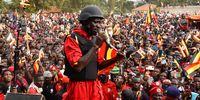 National Unity Platform (NUP) leader Robert Kyagulanyi, known as Bobi Wine (C), addresses his supporters during a campaign meeting near the Saint Joseph Primary School playing grounds in Nantabulirwa village, Mukono District, Uganda, 09 January 2026. Eight presidential candidates, including incumbent Yoweri Museveni and NUP candidate Bobi Wine, are contending in the presidential election scheduled for 15 January.  EPA/ISAAC KASAMANI