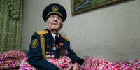 'Portrait of a Veteran, Bishkek, Kyrgyzstan, May 2022'. World War 2 veteran Acek Urmanbetov (98) is recovering from Covid. He is reluctant to evoke the war, but remembers the leg he lost in Belarus, the people he shot and the dead rotting in the trenches. He follows international politics and is devastated by Ukraine’s current war. In 2022, much of the world reopened, and I could finally continue some of my long-term projects that had been interrupted by the Covid crisis. These images are a collection of contrasting moments found on the way: a Cuban actress shines in the Havana night; a woman about to turn 100 recalls the Soviet famine that took her father; a young girl crowned with dandelions embodies the spirit of youth. 2022 was a cruel year in many ways, but the possibility of encountering people again and listening to their stories was genuine solace. © Marylise Vigneau, France, Finalist, Professional competition, Portfolio, Sony World Photography Awards 2023