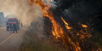 KLEINMOND, SOUTH AFRICA - JANUARY 10: Firefighters try to extinguish a veld fire in Heuningklip on January 10, 2022 in Kleinmond, South Africa. The Overstrand Municipality reported that about 3700 acres of land has been destroyed with one house burned down. (Photo by Gallo Images/Die Burger/Jaco Marais)