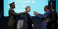 Macky Sall (2-R), President of Senegal, presents Bill Gates (C), founder of the Bill and Melinda Gates Foundation, with the Senegalese National Order of the Lion during the Grand Challenges Annual Meeting 2023 opening ceremony in Dakar, Senegal, 09 October 2023. Great Challenges, supported by the Bill and Melinda Gates Foundation, promotes crowdsourcing solutions for requests to grant proposals in areas such as global health science and innovation. It is the first time the annual meeting has been held in West Africa.  EPA-EFE/JEROME FAVRE