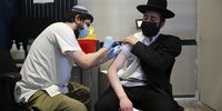 A nurse injects an Ultra Orthodox man with a third shot of Covid-19 vaccine in Jerusalem, Israel. (Photo: EPA-EFE / Abir Sultan)