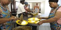 SA Harvest - Nourishing Our Country - Cape Town. The Service Dining Rooms.<br>Left Masooda Peterson-(Kitchen Mananager)  Right Regina Pilander (Cook) Back left Israel Mgizi.women with blue cap Nozuko Klaas (Cook) Marie Slundt (Volenteer) at the back. <br>(Photo Joyrene Kramer)