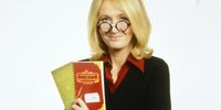 UNSPECIFIED, ENGLAND:  Author JK Rowling poses with one of the Harry Potter books published for Red Nose Day 2001 in England. (Photo by George Bodnar/Comic Relief via Getty Images)