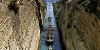 The historic three-masted sailing ship named Belem, which transfers the Olympic Flame for the Paris 2024 Olympic Games to the port of Marseille, crosses the canal of the Corinth Isthmus, Peloponnese, Greece, 28 April 2024. The Olympic Flame is expected to arrive in the port of Marseille on 08 May.  EPA-EFE/VASSILIS PSOMAS