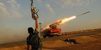 Libyan rebels fire a rocket barrage toward troops loyal to Gaddafi, near Ajdabiyah, Libya, 14 April 2011. (Photo: Chris Hondros / Getty Images)