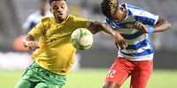Lyle Foster of South Africa and Prince Balde of Liberia during the 2023 Africa Cup of Nations qualifier match between South Africa and Liberia at Orlando Stadium on March 24, 2023 in Johannesburg, South Africa. (Photo by Lefty Shivambu/Gallo Images)