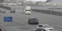 epa10998622 Several cars are stuck in flood water on Fort Lauderdale International Airport's West Perimeter road in Fort Lauderdale, Florida, USA, 13 April 2023.  EPA-EFE/CRISTOBAL HERRERA-ULASHKEVICH