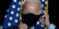 Presumptive Democratic presidential nominee former Vice President Joe Biden puts his mask back on after delivering remarks following a coronavirus briefing with health experts at the Hotel DuPont on August 13, 2020 in Wilmington, Delaware. Harris is the first Black woman and first person of Indian descent to be a presumptive nominee on a presidential ticket by a major party in U.S. history. (Photo by Drew Angerer/Getty Images)