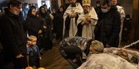 KYIV, UKRAINE - FEBRUARY 22: A woman pays her respects to Captain Anton Olegovich Sidorov during his funeral on February 22, 2022 in Kyiv, Ukraine. on February 22, 2022 in Kyiv, Ukraine. The soldier's death was reported by Ukraine's army on Saturday, one of the first such casualties in weeks, attributing it to a fatal shrapnel wound amid a wave of shelling by separatist rebels in the east. Yesterday, Russian President Vladimir Putin recognized the independence of these breakaway regions and said he would Russian "peacekeepers" to the area. (Photo by Chris McGrath/Getty Images)