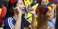 A Japanese fan celebrates a goal as she watches the broadcast of the FIFA World Cup 2018 group H preliminary round soccer match between Colombia and Japan in Medellin, Colombia, 19 June 2018.  EPA-EFE/LUIS EDUARDO NORIEGA A.