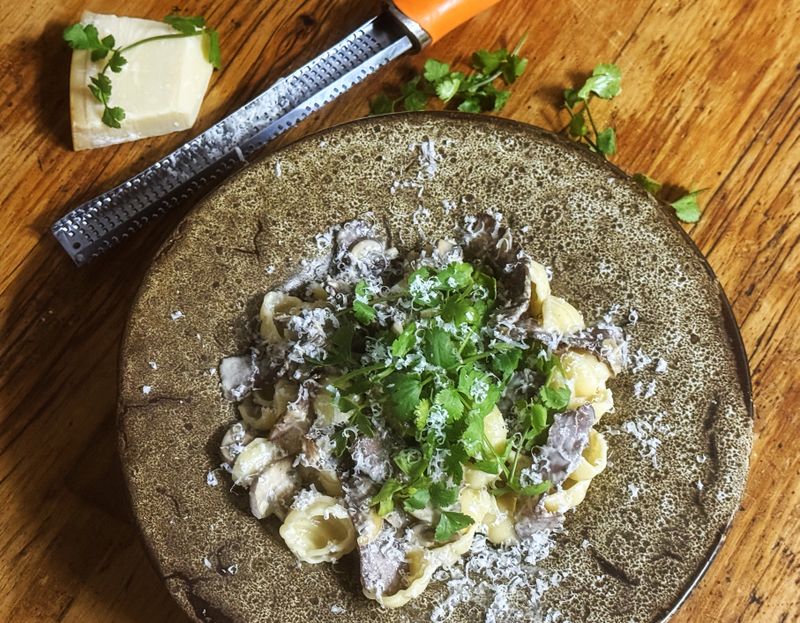Creamy biltong and mushroom pasta with coriander