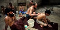 Afghan men and boys bathe in the hot room at a hammam on March 5, 2010 in Herat, Afghanistan. It is traditional for Afghans to visit the hammam on a friday, the Muslim day of rest.  (Photo by Majid Saeedi/Getty Images)