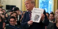 WASHINGTON, DC - FEBRUARY 06: U.S. President Donald Trump holds up a newspaper as he speaks one day after the U.S. Senate acquitted on two articles of impeachment, in the East Room of the White House February 6, 2020 in Washington, DC. After five months of congressional hearings and investigations about President Trump’s dealings with Ukraine, the U.S. Senate formally acquitted the president of charges that he abused his power and obstructed Congress.  (Photo by Mark Wilson/Getty Images)