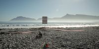 A warning sign in Hout Bay Beach to raise awareness among locals about what could happen if mining on the west coast is not stopped. (Photo: ‘Ours Not Mine’ film)