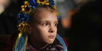 MANCHESTER, ENGLAND - FEBRUARY 24: Children wear crowns made from  flowers as members of the Manchester Ukrainian community attend morning mass at St Mary's Ukrainian Catholic Church where the congregation prayed for, and showed their support for, relatives and the people of Ukraine on February 24, 2022 in Manchester, England. Overnight, Russia launched a large-scale offensive on multiple Ukrainian cities, drawing condemnation from the British government and many allied nations. (Photo by Christopher Furlong/Getty Images)