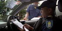 Dominic September (35), senior supervisor at Deep Blue Security Armed Response completes paperwork at a checkpoint in Hout Bay, 10 January 2019. Photo: Leila Dougan