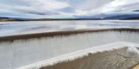 [Theewaterskloof Dam full and overflowing - a wonderful sight]. Photographer: [Joe van Dorsten].