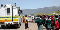 Residents block roads in Tabase,  Mthatha, Eastern Cape in January this year while protesting that their children were excluded from the scholar transport system. (Photo: Hoseya Jubase)