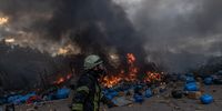 A Ukrainian firefighter in action trying to extinguish the fire at the storage with chemicals which was hit by Russian shelling, on the outskirts of Brovary, the eastern frontline of Kyiv (Kiev) region, Ukraine, 08 March 2022. According to the United Nations High Commissioner for Refugees (UNHCR), Russia's military invasion of Ukraine, which started on 24 February, has destroyed civilian infrastructure and caused civilian casualties, with tens of thousands internally displaced and over two million refugees fleeing the country.  EPA-EFE/ROMAN PILIPEY
