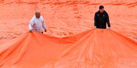 Grounds staff prepare the courts for the start of play after a rain delay at Foro Italico on May 10, 2023 in Rome, Italy. (Photo by Alex Pantling/Getty Images)