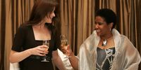 28 February 2008. South Africa. Western Cape. Cape Town. Carla Bruni (L), wife of French President Nicholas Sarkozy, toasts with South Africa's deputy President Phumzile Mlambo-Ngcuka during a State Banquet at Tuynhuys. Sarkozy is on a two day state visit to South Africa.