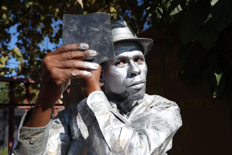 Joburg’s ‘silver men’ on the politics and paint of street performing