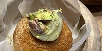 Sticky rice donut filled with red bean paste and pistachio white chocolate ganache. (Photo: Supplied)  <br>