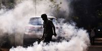 An Indian health worker fumigates a street in a residential area to prevent the spread of mosquito-borne diseases, in Chennai, India, 29 March 2023.  EPA-EFE/IDREES MOHAMMED