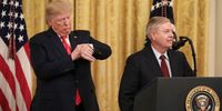 WASHINGTON, DC - NOVEMBER 6: (L-R) President Donald Trump pretends to check his watch after Sen. Lindsey Graham (R-SC) mentioned upcoming Senate votes during an event about judicial confirmations in the East Room of the White House on November 6, 2019 in Washington, DC. More than 150 of the president's federal judicial nominees have been confirmed by the Republican-controlled Senate. (Photo by Drew Angerer/Getty Images)