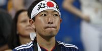 A supporter of Japan reacts after the FIFA World Cup 2018 round of 16 soccer match between Belgium and Japan in Rostov-On-Don, Russia, 02 July 2018. Japan lost the match 2-3. EPA-EFE/ATEF SAFADI  