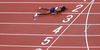 TOKYO, JAPAN - AUGUST 06: Ludovic Ouceni of Team France falls onto the track during the Men's 4x400 metres relay heat on day fourteen of the Tokyo 2020 Olympic Games at Olympic Stadium on August 06, 2021 in Tokyo, Japan. (Photo by Patrick Smith/Getty Images)